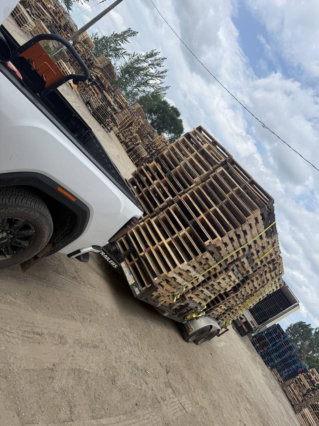 Trailer loaded with pallets — 300 hauled in for the Long Prairie farm