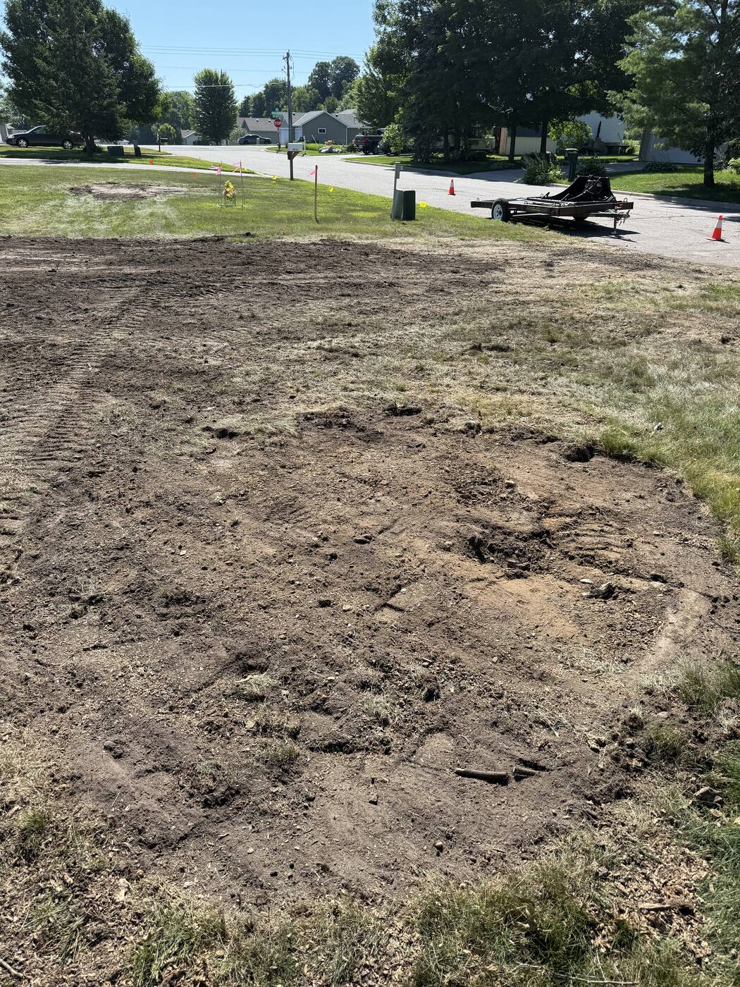 Same spot after the stump was ground out and roots removed