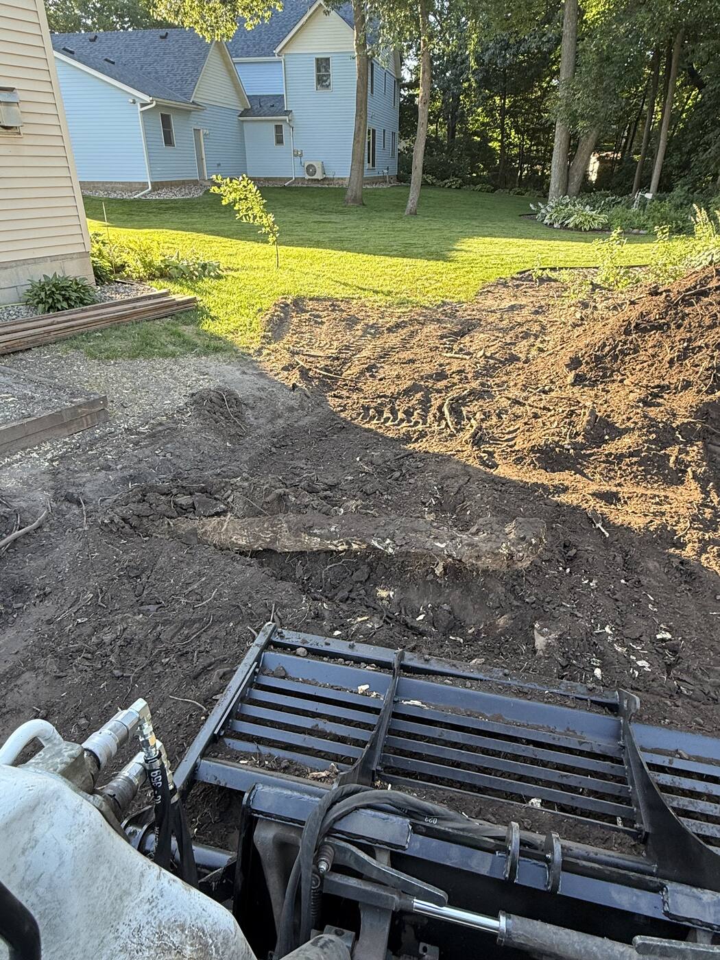 Pulling roots with the skid loader grapple — root removal in St. Joseph, MN